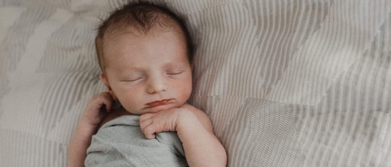Sleeping baby wrapped in a soft blanket