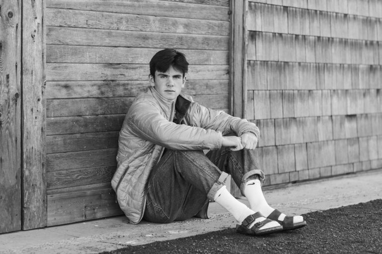 The earnest gaze of a young man draws the viewers eye in this timeless black and white image.