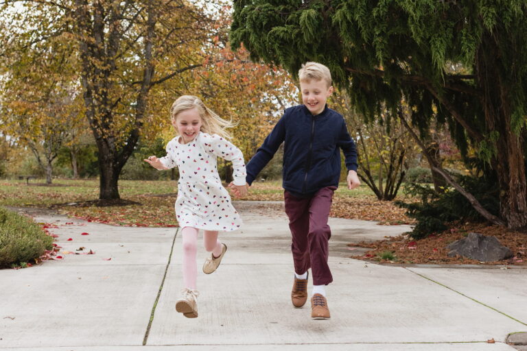 Children running on path in autumn park